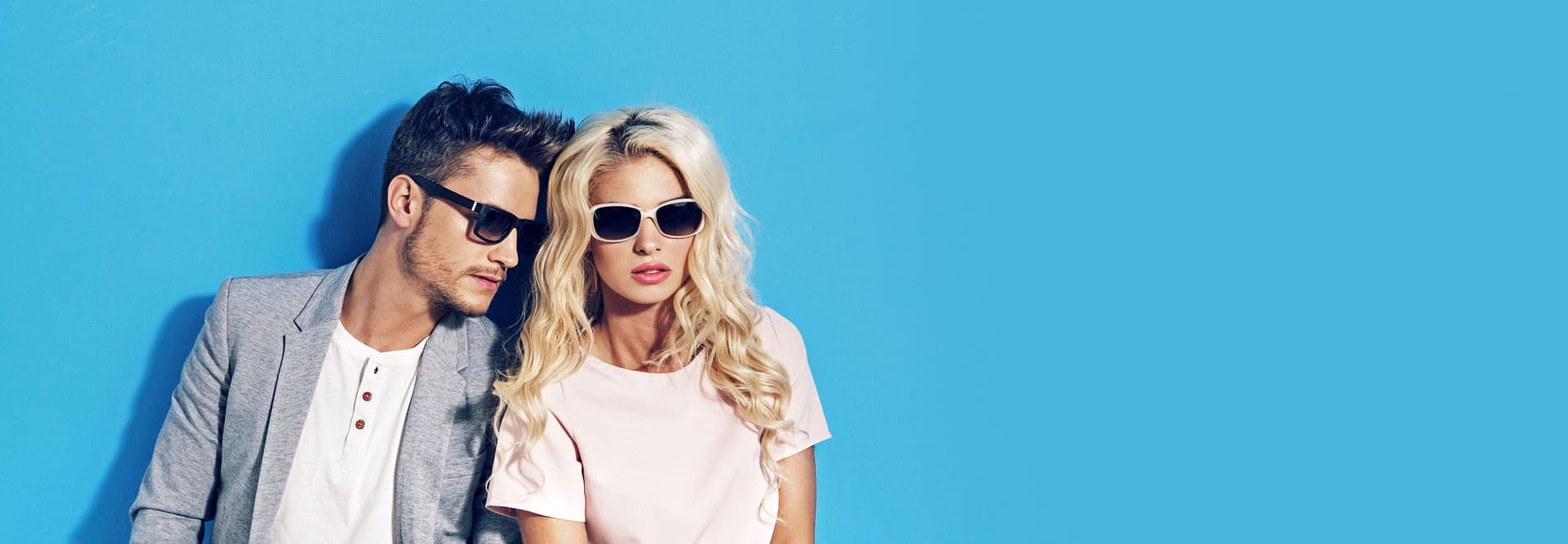 Lady and gent wearing sunglasses